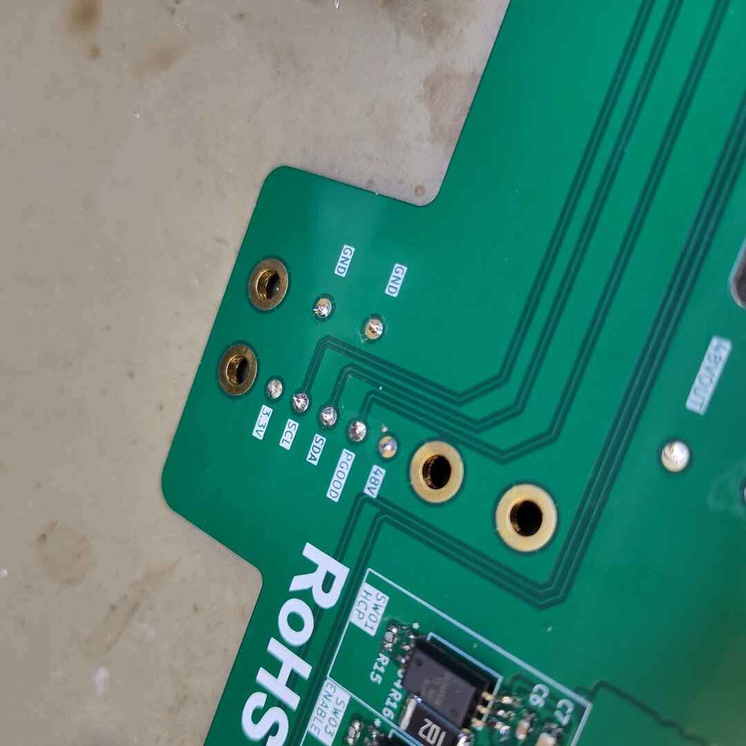 PCB with pogo pins visible from the back side