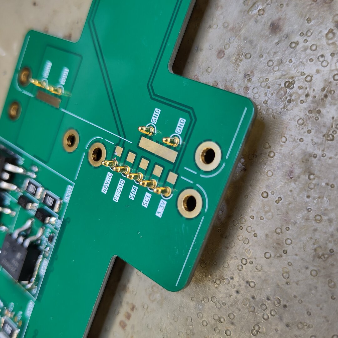 PCB with pogo pins visible from the front side